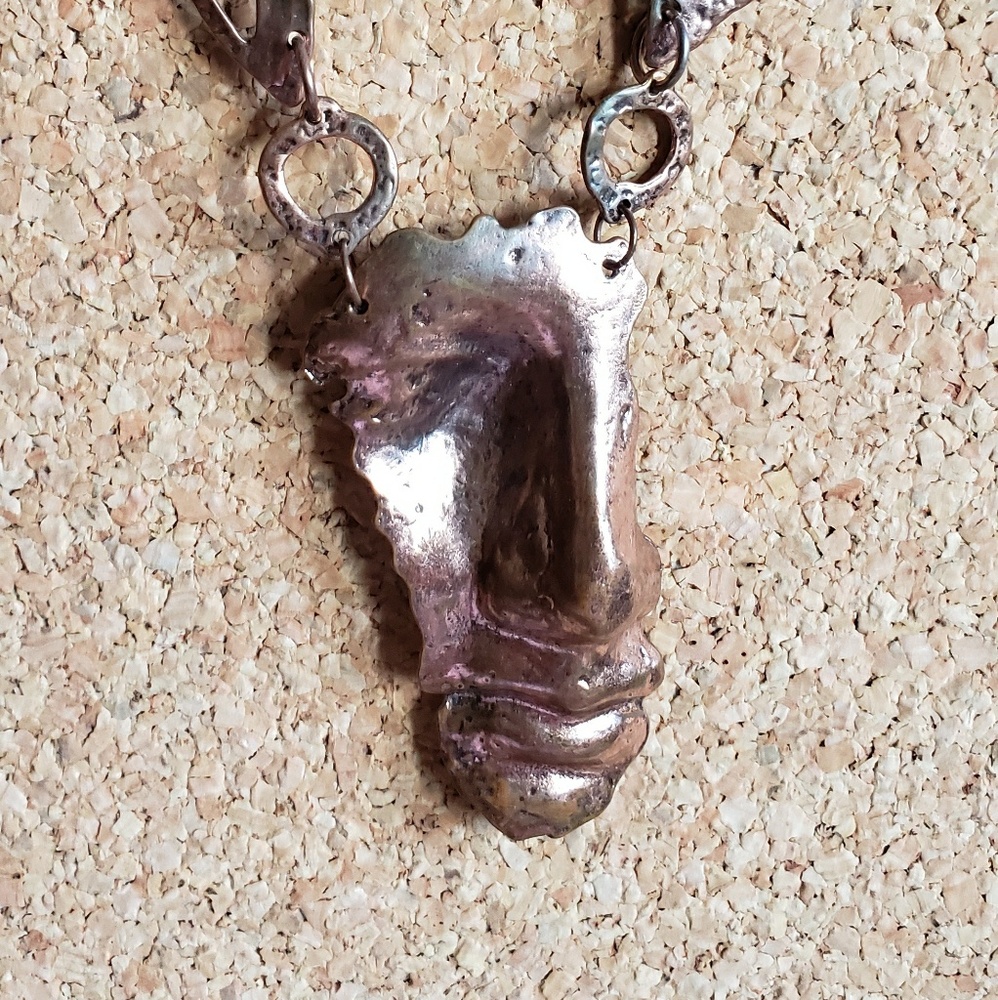 Bronze face necklace